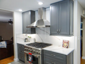 Kitchen remodel with new cabinets and stove built in with new lighting