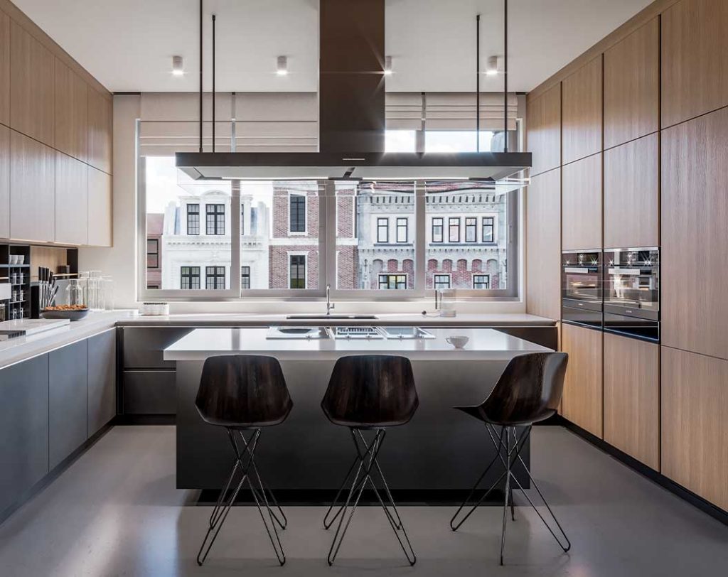 A modern kitchen with sleek, minimalist design. It features wooden cabinets, a central island with a built-in stovetop and oven, and three dark wooden bar stools. Large windows provide a view of classic, brick buildings outside. Pendant lights hang from the ceiling.