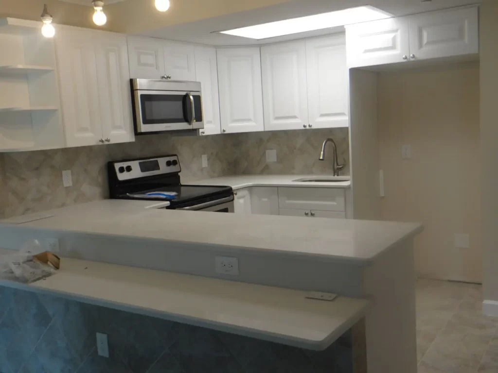 Cabinet and custom refrigerator in a newly remodeled kitchen in Lakeland.